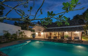 The pool is 1.3m / 4.5 feet deep  with jacuzzi jet seating and stair entry.