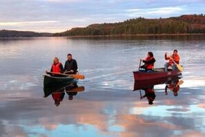 Canoeing past end of dock on Little Hawk Lake.