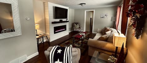 Living Room. 55” Smart TV, Couch, Recliner, Chair, Lamps & Glass Tables!