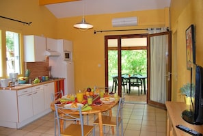 Prepare meals in the kitchenette and enjoy them at the dining table.