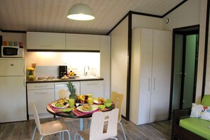 Prepare meals in the kitchenette and enjoy them at the dining table.