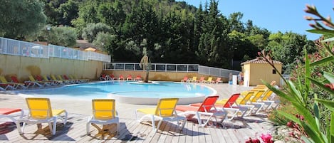 Relax on the sun loungers around the pool.