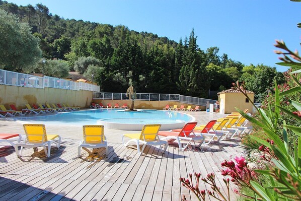 Relax on the sun loungers around the pool.