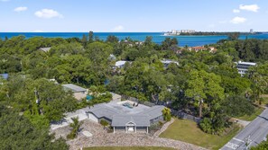 Aerial view of the property with the Gulf as the backdrop