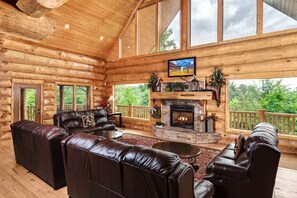 Lots of space in main living room for everyone to gather around the fireplace