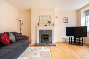 Comfortable living room with large Tv.