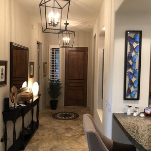 entry way with guest bedrooms to the right and left