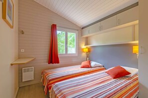 The third bedroom contains 2 Single beds.