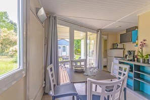 Prepare meals in the kitchenette and enjoy them at the dining table.