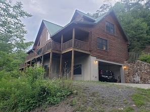 Side / rear shot of home with garage in use.