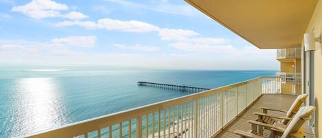 True beachfront upscale condo with wrap around balcony and spectacular views. 