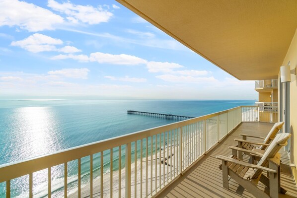 True beachfront upscale condo with wrap around balcony and spectacular views. 