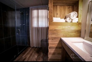 Check out the big shower stall and vanity in the master bath! All bath and bed linens for your stay are provided, too.