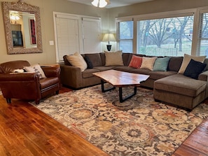 Living has large windows to enjoy the pecan orchard