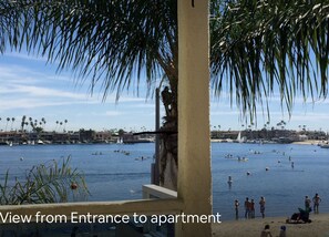 View from the entryway w/door open. Love the view & breeze; Great neighborhood