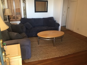 Living room with sleeper sofa w/ thick memory foam, & w/ TV & in bedroom 