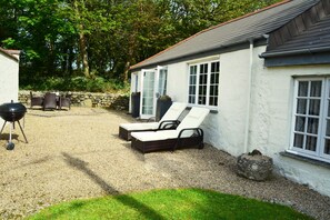 Completely private patio courtyard with a small wood to the north and lawn to the south