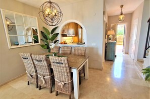 Modern dining area for six guests on a side of the lounge