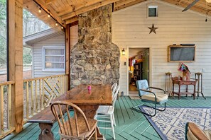 screen porch with table for outdoor dining