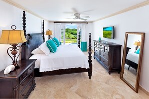 The master bedroom with a king bed has direct access to the pool deck