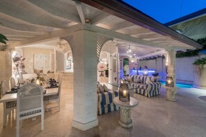 Harmony House - A covered patio area with a built-in bar, plunge pool and alfresco dining