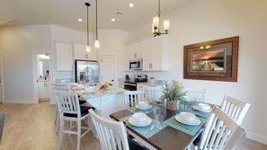 Kitchen and dining area with place settings for 9 comfortably