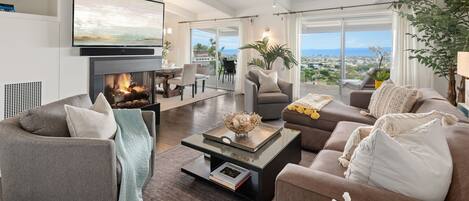 Grand living room with city and ocean views