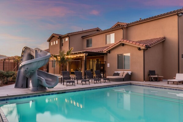 Enjoy a private pool with a slide and a hot tub
