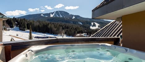 Private hot tub with mountain views on a penthouse Whistler condo