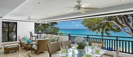 Coral Cove 7-Sunset - The luxury verandah with incredible views of the beautiful Paynes Bay Beach