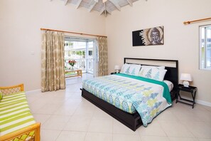 The master bedroom has a balcony overlooking the pool