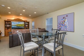 Basement living room - - Table and large flat screen TV
