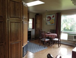 view from inside front door. Couch to the right and kitchen ahead and left