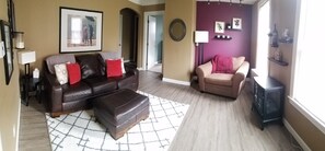 Leather couch, oversized chair, electric fireplace