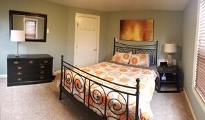 Bedroom: queen bed, bureau, closet