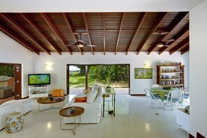 The spacious living area opens up onto the covered terrace