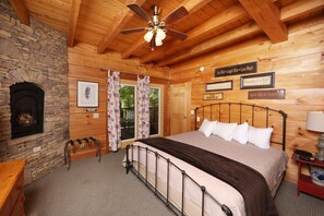 Main Floor Bedroom with King Bed and Gas Fireplace