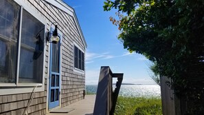 This charming cottage is right on the water