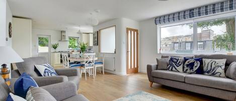 A beautiful seaside themed open plan living and dining area