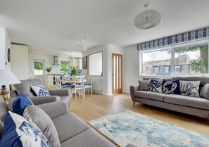 A beautiful seaside themed open plan living and dining area