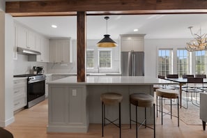 Have a few drinks at the kitchen island while watching the designated chef in action.