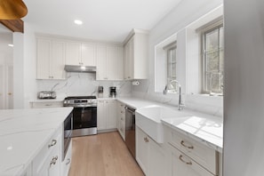 With modern cooking appliances and spacious countertops, the kitchen has it all!