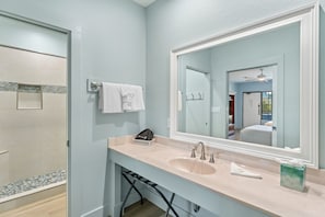 Bathroom vanity counter with large mirror