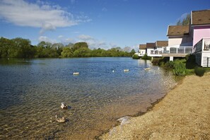 Next to the lake house, a small shingle beach area is popular with the little ones for paddling
