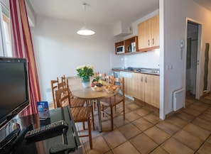 Whip up a meal in the kitchenette before enjoying it at the dining table.
