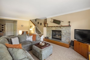 Stone-Framed Fireplace and Flat Screen TV