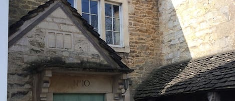 Front of cottage - with a lovely wood store for cosy fires 