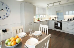 Ground floor: Kitchen with dining area which has sea views