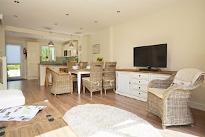 Ground floor: Open plan living space with sitting and dining areas seating six