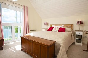 First floor: Master bedroom with 5' bed, wardrobe and amazing views over the lake